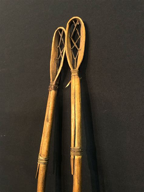 PAIR OF CHEROKEE NATIVE LACROSSE STICKS, 36" & 34" LONG - Able Auctions