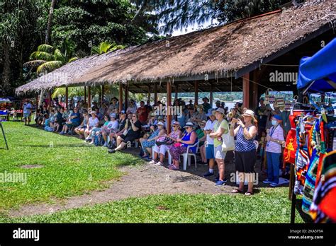 Tourist seated under thatched roof watching cultural displays at the ...