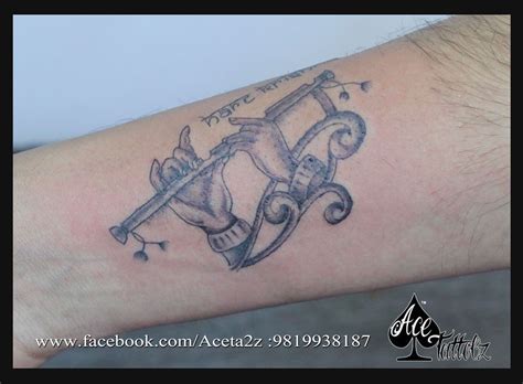 "Hare Krishna" titled tattoo engraved on the client's forearm # ...