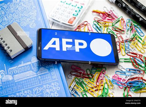 In this photo illustration an AFP Agence France Presse logo seen ...