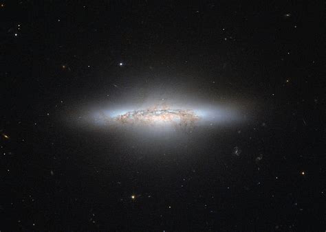 Lenticular Galaxies Are Quiet, Dusty Stellar Cities