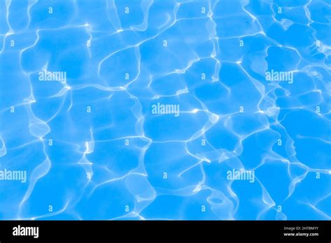 Swimming Pool Surface reflection background Stock Photo - Alamy