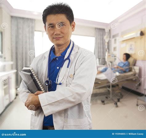 Doctor in Hospital Room with Patient Stock Image - Image of doctor, crossed: 19394855