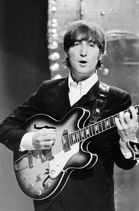 John Lennon from The Beatles performs 'Rain' and 'Paperback Writer' on ...