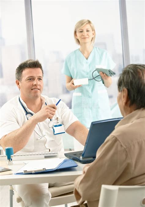 Doctor Discussing Diagnosis With Patient Stock Image - Image: 18076727