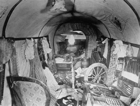 Interior of prairie schooner crammed w. clothes, furniture & other possessions, typical of ...