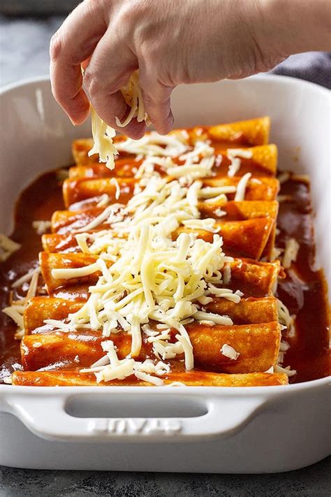 These Cheese Enchiladas are corn tortillas filled with monterey jack cheese and topped with a h ...