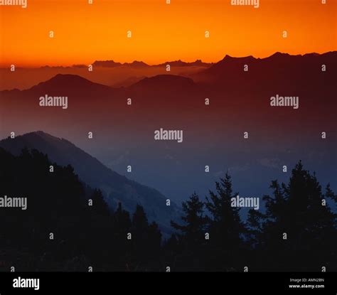 mountain range at sunrise Stock Photo - Alamy