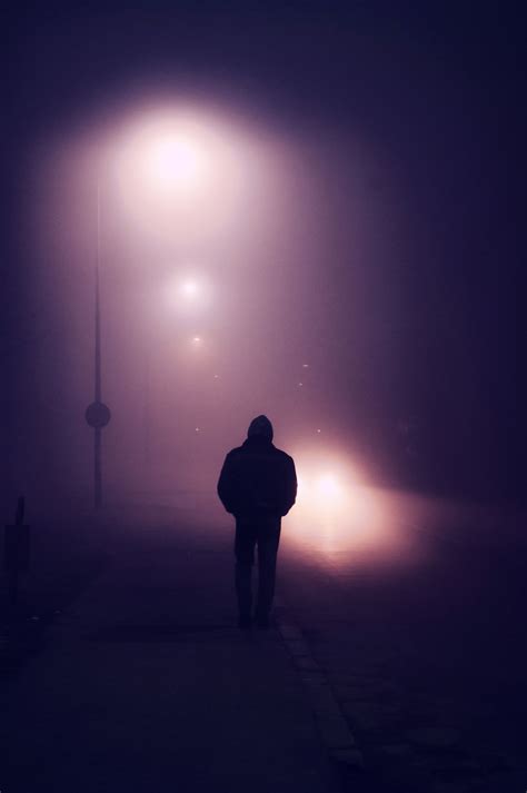 Fog - Silhouette of a young man walking down the street on a foggy evening | Lonely art, Fog ...