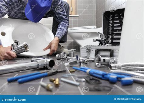 Plumber at Work in a Bathroom, Plumbing Repair Service, Assemble Stock Photo - Image of install ...