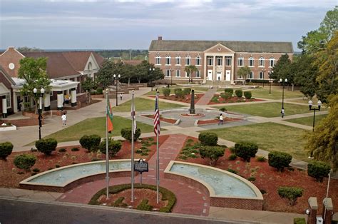 an aerial view of a campus with flags and buildings