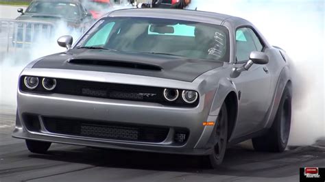 Watch this 2018 840-hp Demon fight a 707-hp Hellcat on the quarter mile ...