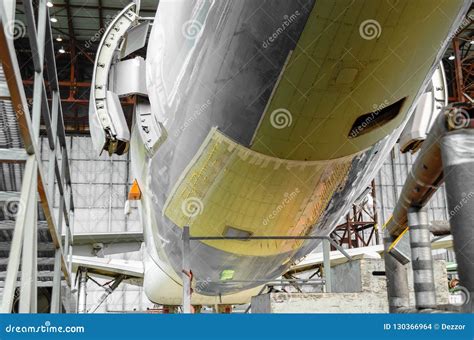 Passenger Aircraft on Maintenance and Fuselage Repair after Damage in Airport Hangar. Stock ...