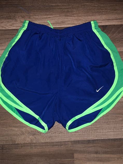 Royal blue and lime green NIKE shorts. Gently worn with no flaws. See pictures for details ...