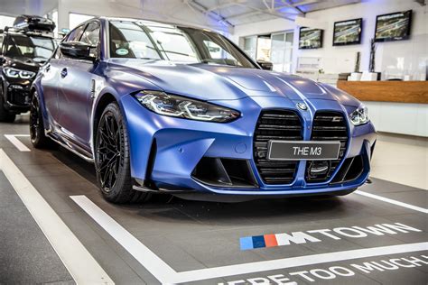 2021 BMW M3 displayed in the Frozen Portimao Blue color from BMW Individual