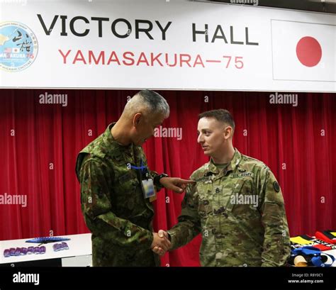 Sergeant Major of the Japan Ground Self-Defense Force, Warrant Officer Susumu Takahashi, greets ...