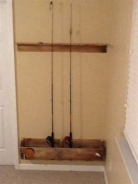 Wall Mounted fishing rod holder made by my Husband and I...Hand carved ...