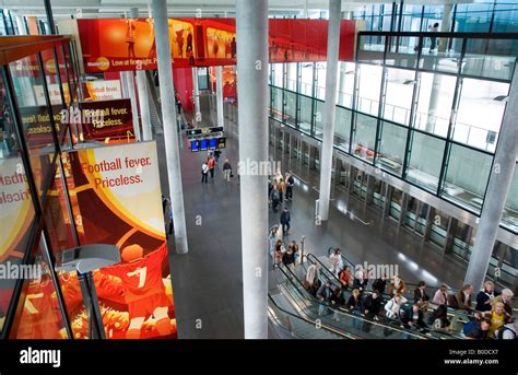 Zurich airport the Skymetro station at Terminal E passengers are going ...