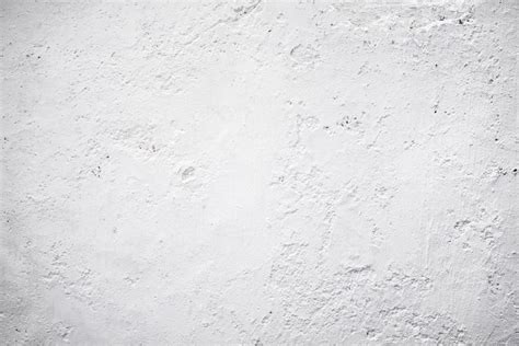 Premium Photo | A white wall with a rough texture background