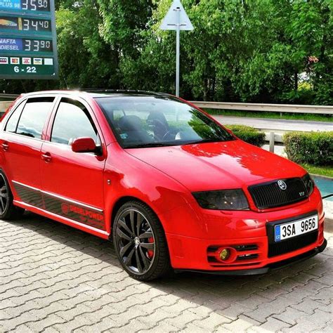 Red Skoda Fabia VRS at a Gas Station