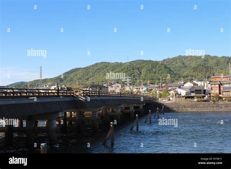 View of Uji city with the Uji Bridge, Uji River, houses, mountain and blue sky, Japan Stock ...