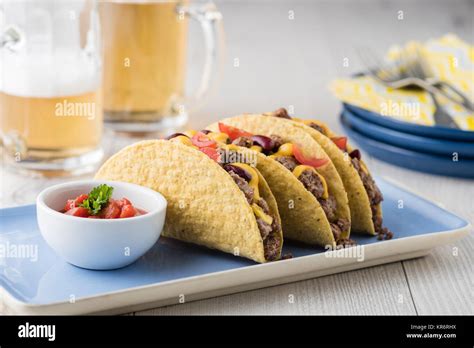 Mexican tacos with beef, cheddar cheese, tomato Stock Photo - Alamy