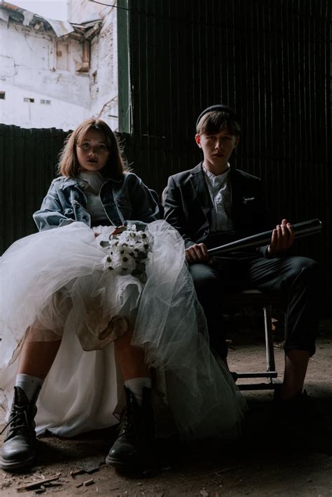 Man in Black Suit Sitting Beside Woman in White Wedding Gown · Free ...