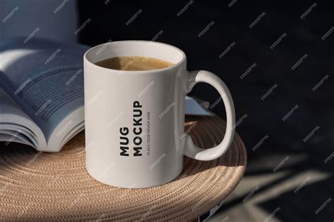 Premium PSD | A coffee mug mockup on a table with a book