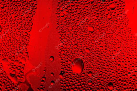 Premium Photo | Red macro water drop texture,water drops on red background