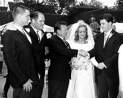 Rick and Kris Nelson wedding reception - April 1963 - The guy with his hand out stretched to ...