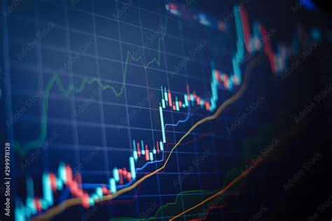 Foto de Closeup financial chart with uptrend line candlestick graph in ...