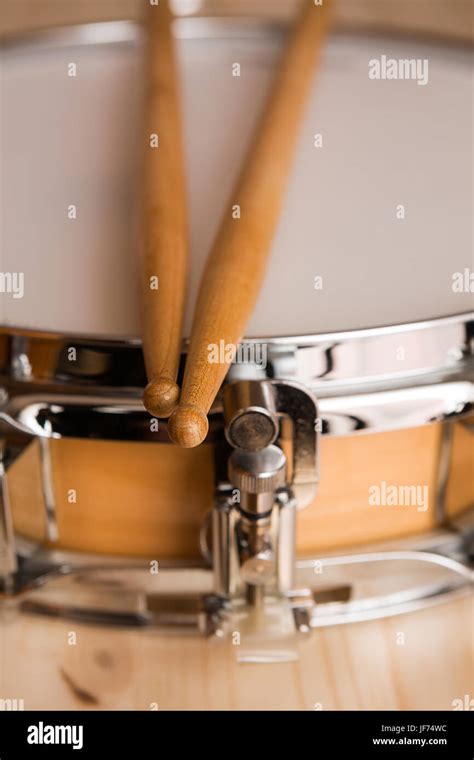 Drum sticks over a snare drum Stock Photo - Alamy