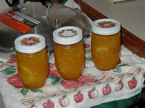 three jars filled with liquid sitting on top of a table