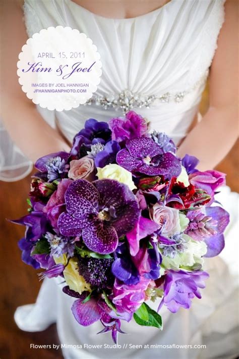 Purple Vanda orchids, clematis, parrot tulips, freesia, hyacinth, roses, lisianthus and trach ...