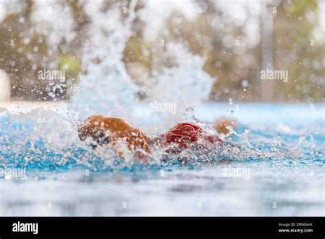 A water splash while a person swimming in pool Stock Photo - Alamy