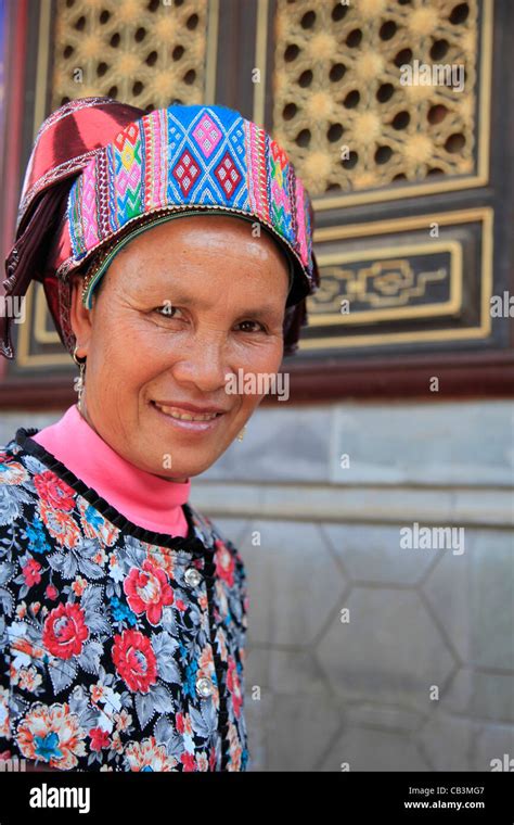 China, Kunming, Portrait of woman in traditional clothing Stock Photo - Alamy