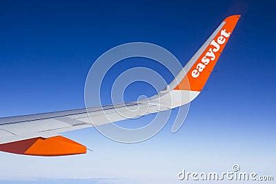 The Wing And Winglets Of An Airbus A320 Commercial Airliner With A Company Logo While In Flight ...