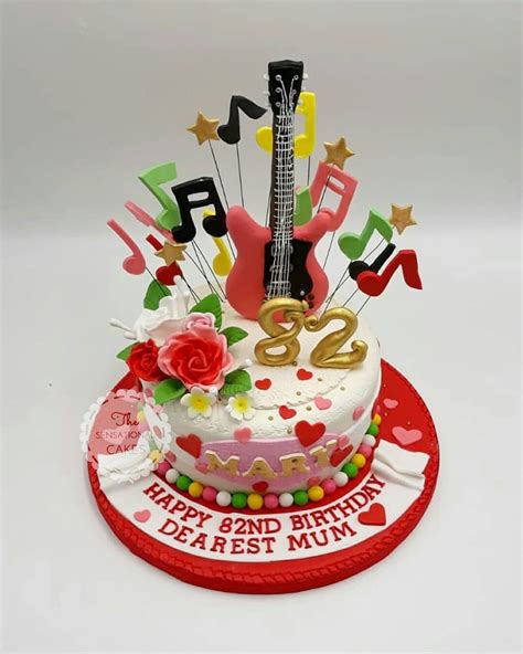 Still rocking at 82nd birthday! Beautiful musical guitar and flower design customized cake! # ...