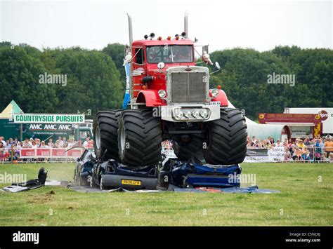 Monster truck crushing cars hi-res stock photography and images - Alamy