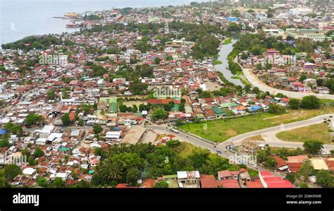 Aerial drone of city of Iligan near the sea on the island of Mindanao, Philippines. Iligan City ...