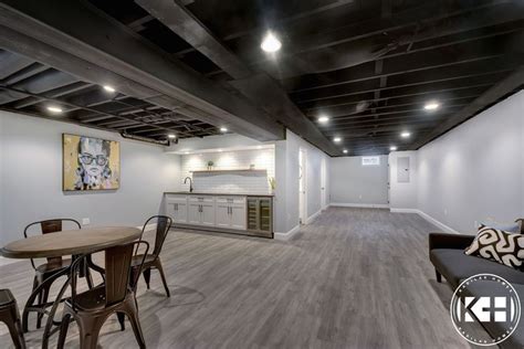 Finished basement with wet bar, babylon gray quartz, subway tile, black ...