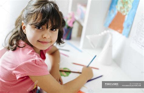 Portrait of little girl drawing on desk at home — leisure activity, female - Stock Photo ...