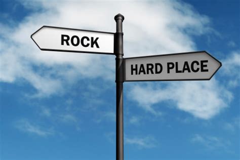 Stuck Between A Rock And A Hard Place Stock Photo - Download Image Now ...