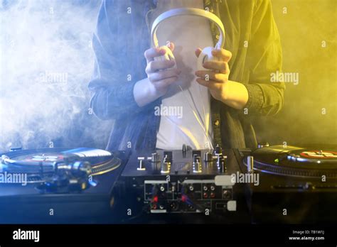 Female DJ mixing music Stock Photo - Alamy