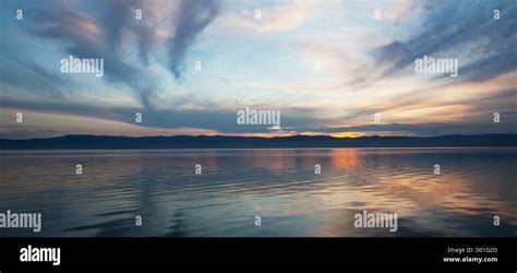 Sunrise scene on lake Stock Photo - Alamy