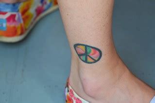 Peace Sign Tattoo | The colors on this young ladies tattoo k… | Flickr