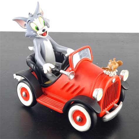 Tom and Jerry with Spike Looney Tunes statue by Warner Bros