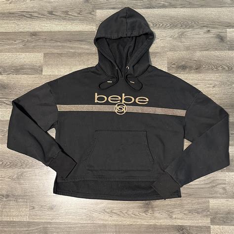 Bebe hoodie Black hoodie Dark gold print Lightly... - Depop