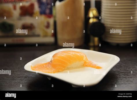 Salmon Sushi in japanese sushi restaurant Stock Photo - Alamy