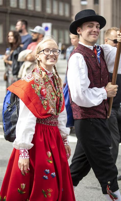 Estonian People In Traditional Clothing Walking The Streets Of Tallinn ...